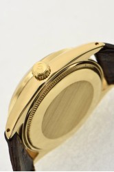 Rolex Oyster Perpetual SCOC 18Kt Gold Herrenuhr mit rändierter Index-Lunette