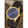 ROLEX Oyster Perpetual Date mit attraktivem blauen Zifferblatt in 18Kt Gold-Ausführung