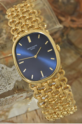 Patek Philippe Ellipse d'Or 18K Gelbgold-Herrenuhr mit elegantem 18Kt Goldarmband